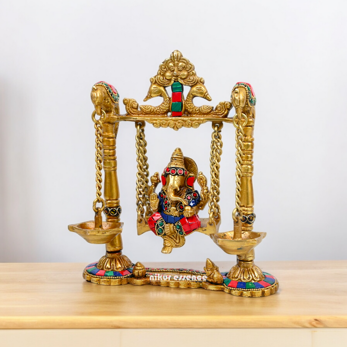 Buy Brass Ganesh Bhagwan Jhula with Two Diyas – Handcrafted Ganesha Idol 22.9 cm Nikuressence