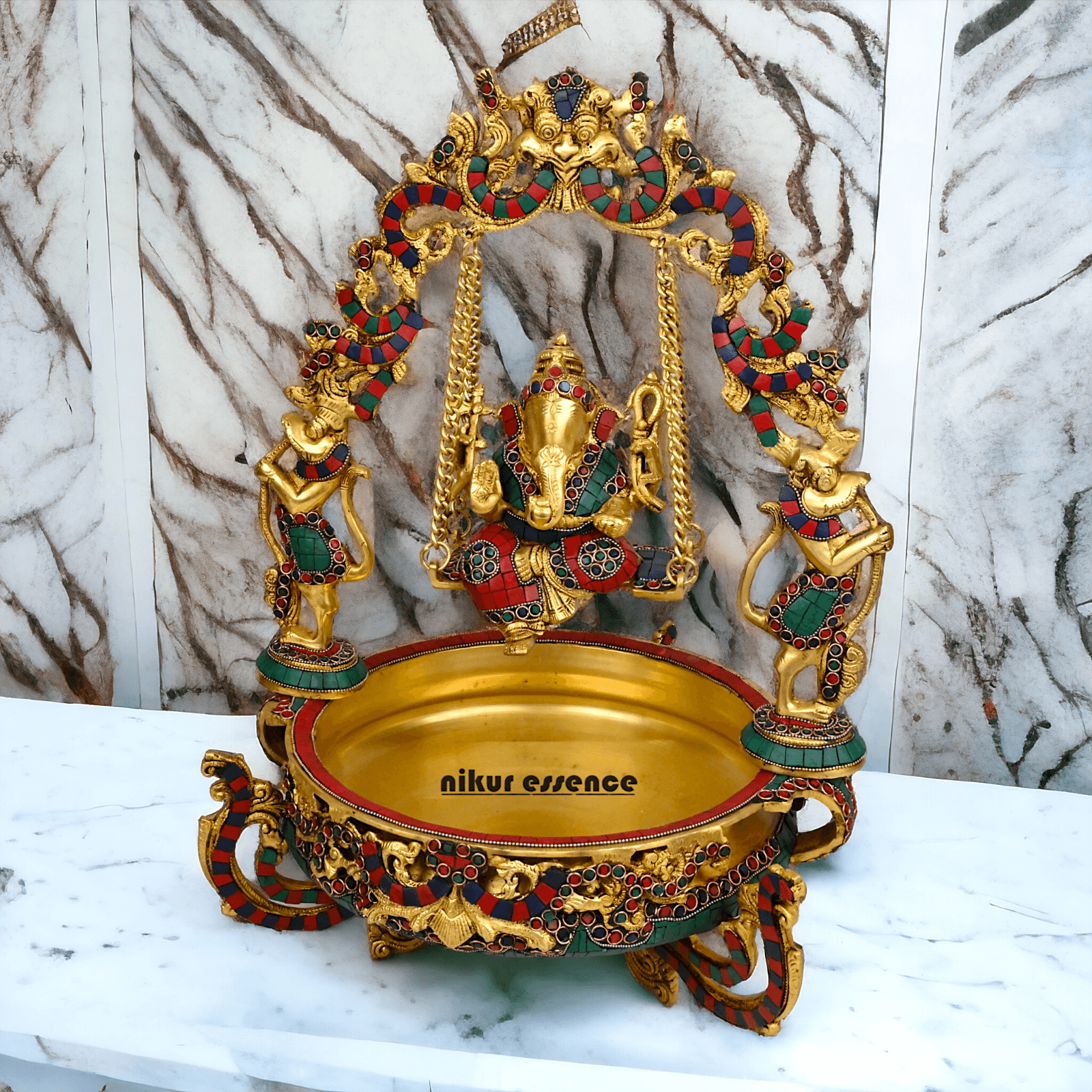 Brass Ganesh Jhula Urli with stone work -nikuressence Nikuressence