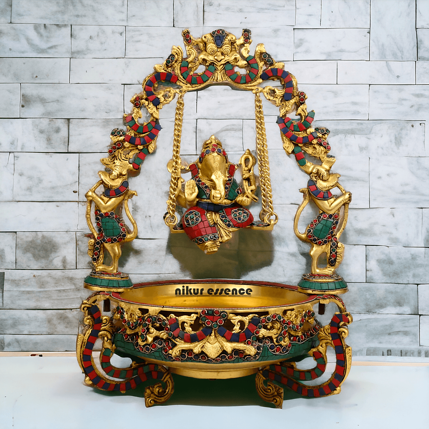 Brass Ganesh Jhula Urli with stone work -nikuressence Nikuressence