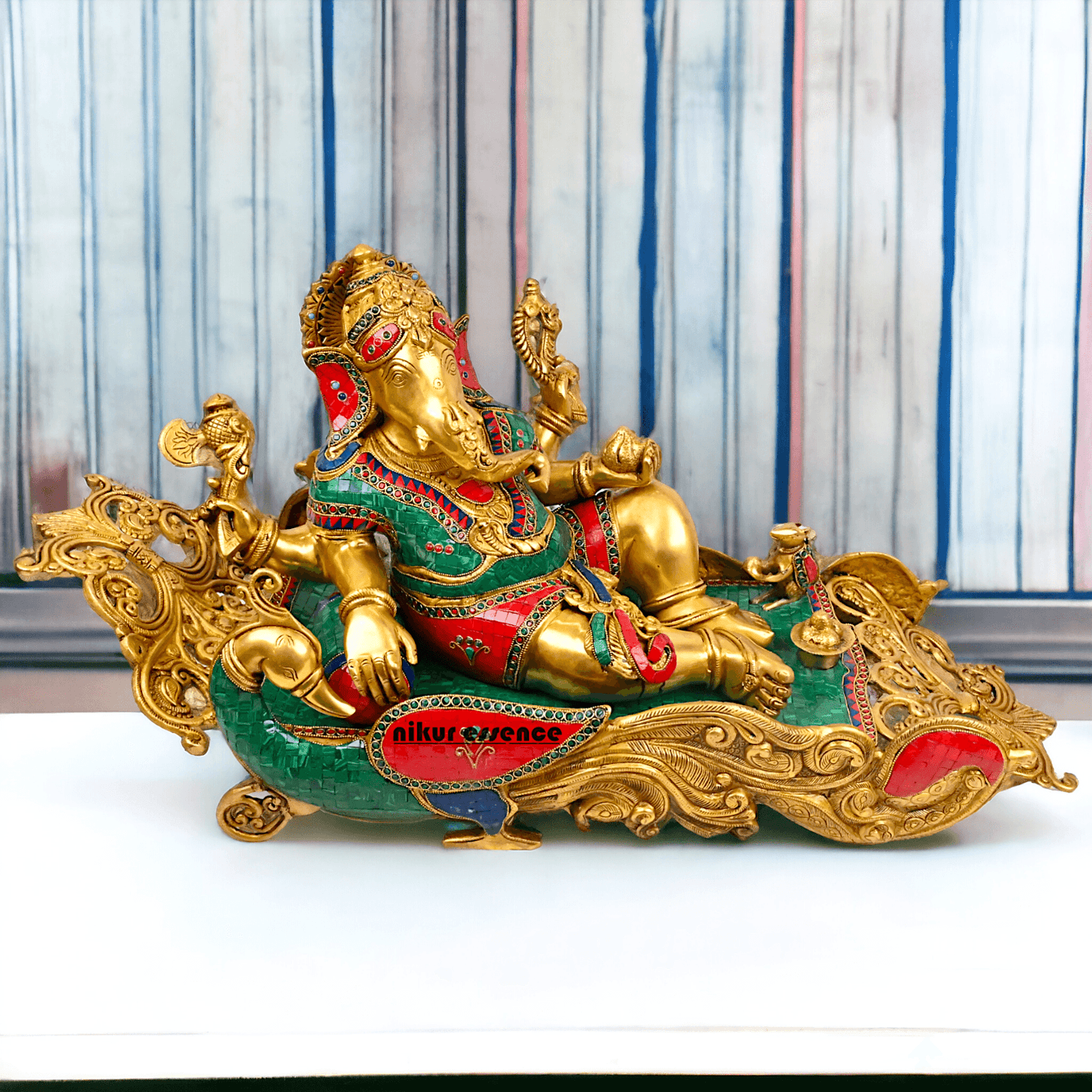 Buy pure Brass Ganesha Idol Relaxing on Peacock Recliner - nikur essence Nikuressence