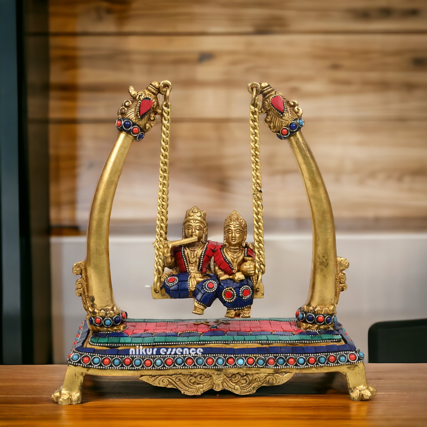 Buy Brass Krishna swing jhula Idol with stone work by Nikur Essence - 11 inches height Nikuressence
