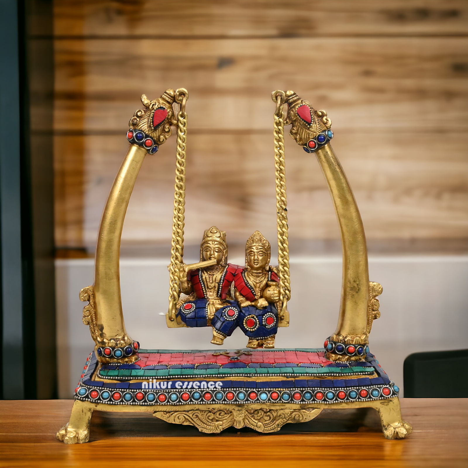 Buy Brass Krishna swing jhula Idol with stone work by Nikur Essence - 11 inches height Nikuressence