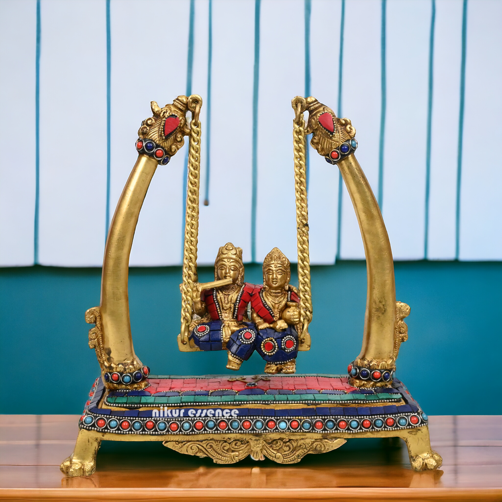 Buy Brass Krishna swing jhula Idol with stone work by Nikur Essence - 11 inches height Nikuressence