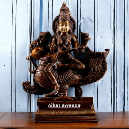 Brass Statue of Hindu Goddess Saraswati, the Patron of Wisdom, Playing Veena atop a Majestic Peacock with a Parrot Perched on Her Hand, 20 Inches Nikuressence
