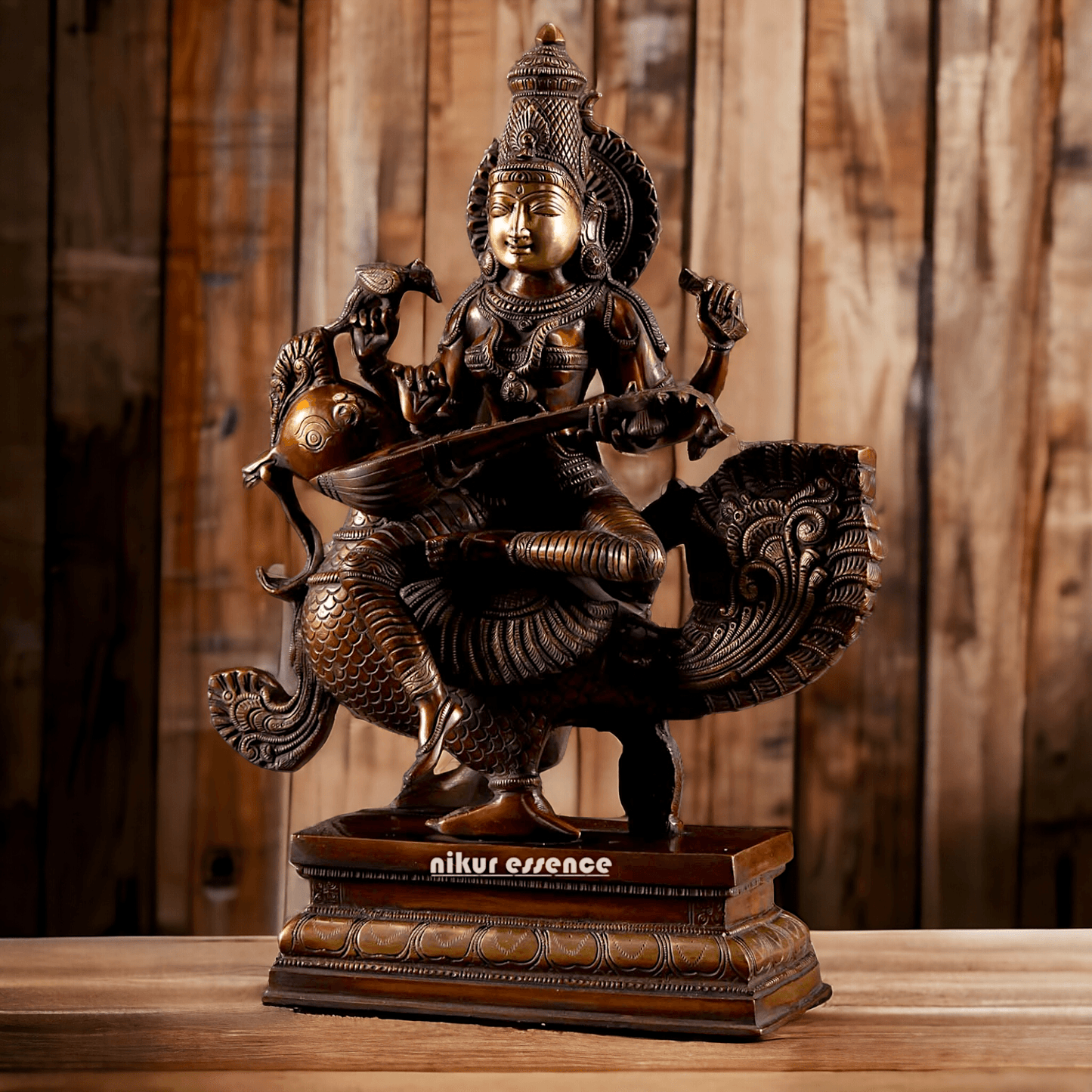 Brass Statue of Hindu Goddess Saraswati, the Patron of Wisdom, Playing Veena atop a Majestic Peacock with a Parrot Perched on Her Hand, 20 Inches Nikuressence