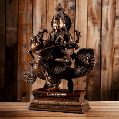 Brass Statue of Hindu Goddess Saraswati, the Patron of Wisdom, Playing Veena atop a Majestic Peacock with a Parrot Perched on Her Hand, 20 Inches Nikuressence