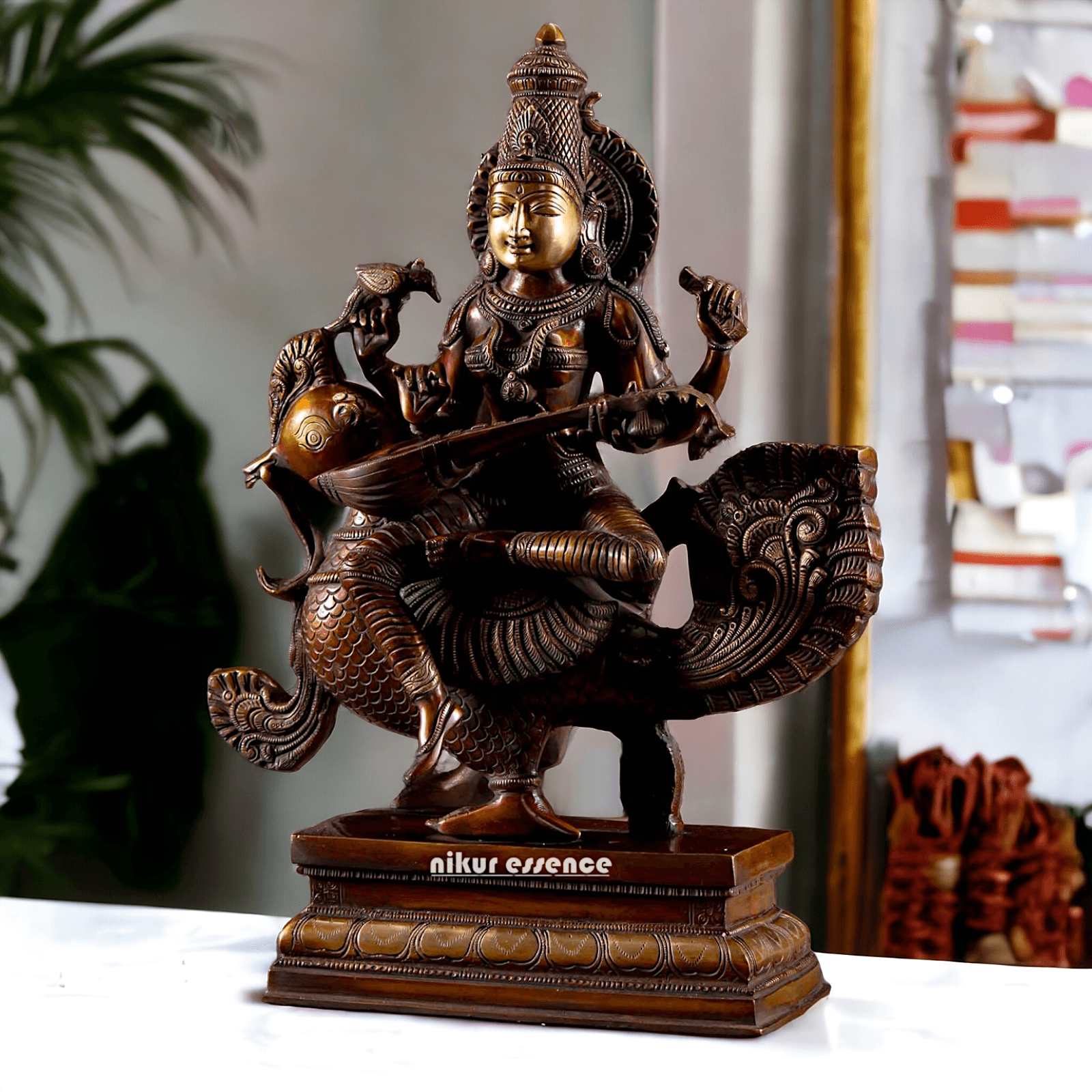 Brass Statue of Hindu Goddess Saraswati, the Patron of Wisdom, Playing Veena atop a Majestic Peacock with a Parrot Perched on Her Hand, 20 Inches Nikuressence