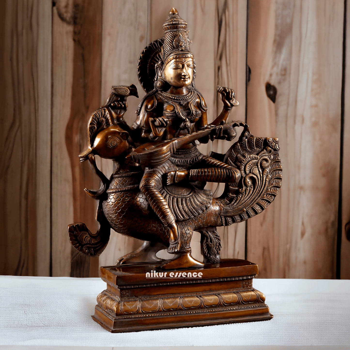 Brass Statue of Hindu Goddess Saraswati, the Patron of Wisdom, Playing Veena atop a Majestic Peacock with a Parrot Perched on Her Hand, 20 Inches Nikuressence