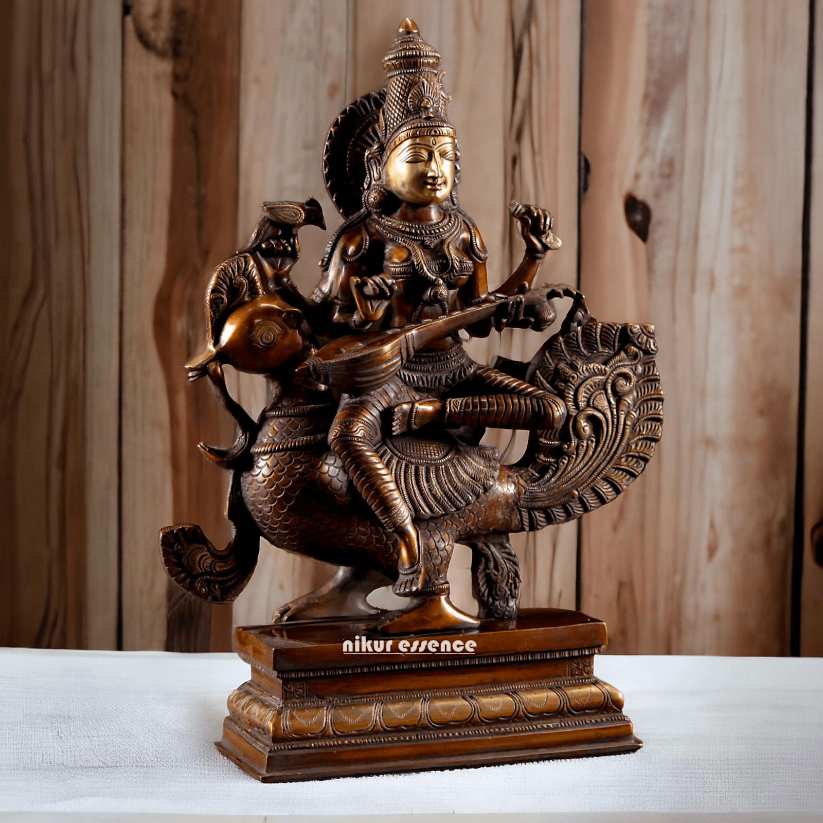 Brass Statue of Hindu Goddess Saraswati, the Patron of Wisdom, Playing Veena atop a Majestic Peacock with a Parrot Perched on Her Hand, 20 Inches Nikuressence