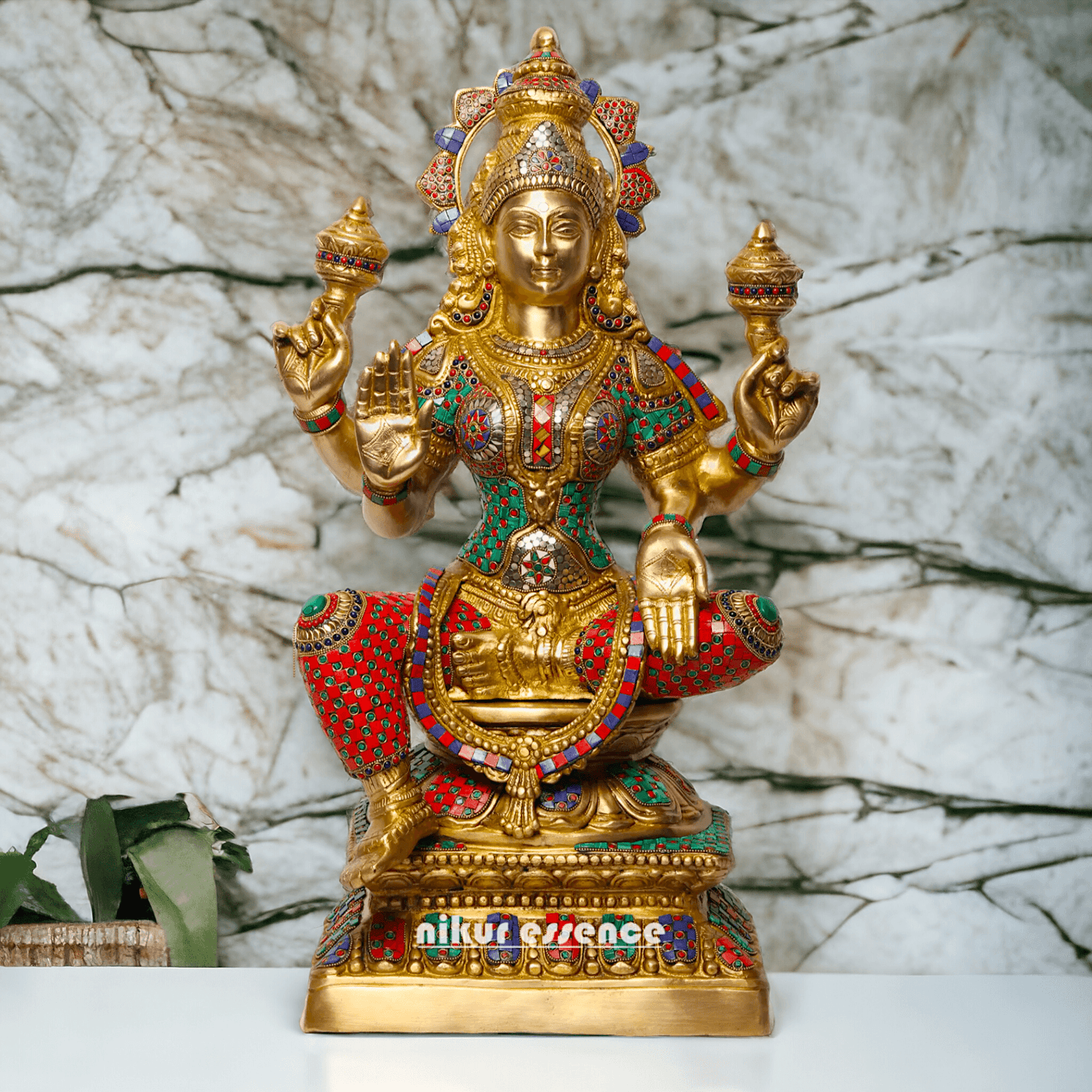 Buy Online Brass Statue of Lakshmi, Sitting Gracefully with Four Arms, Adorned with Intricate Inlay Work Nikuressence