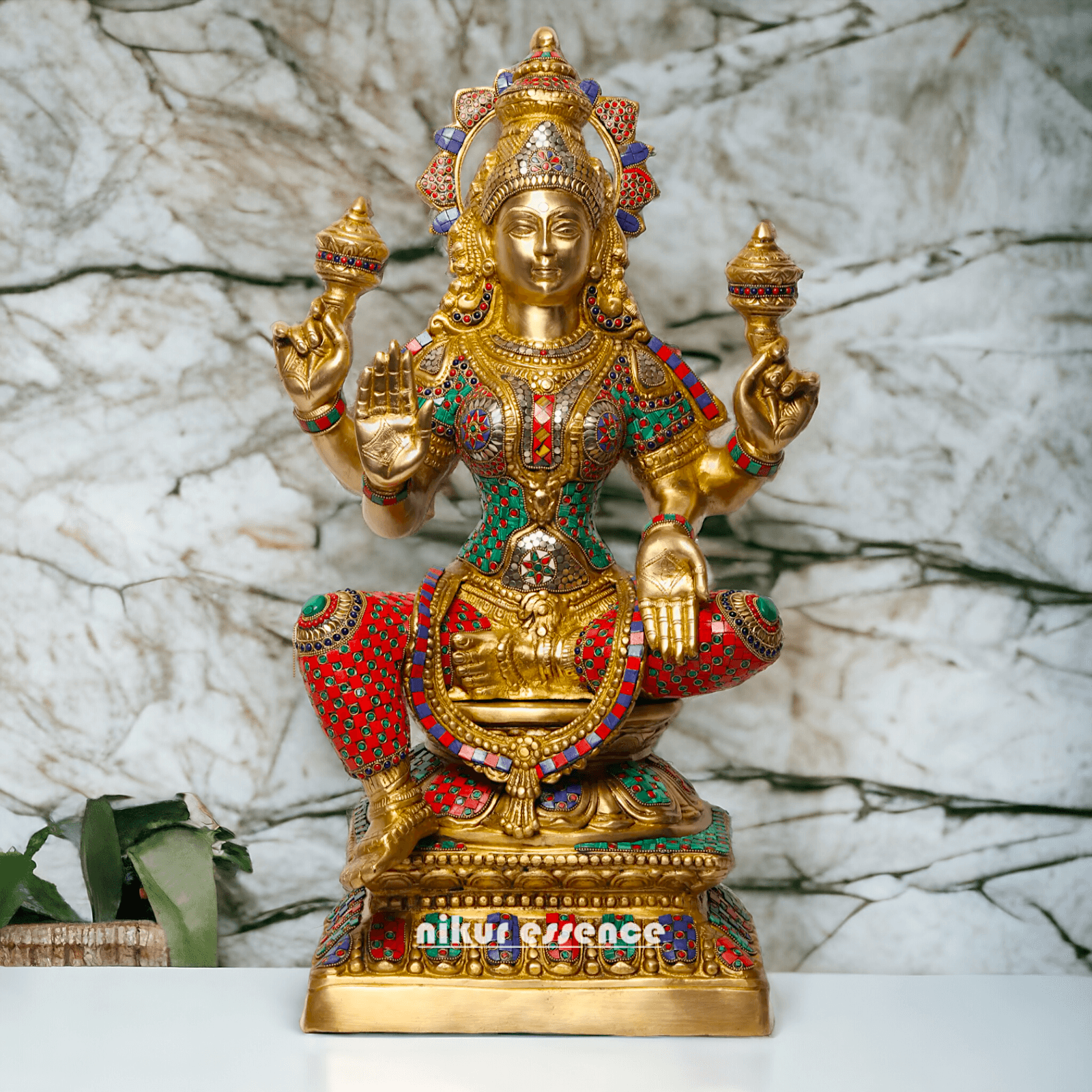Buy Online Brass Statue of Lakshmi, Sitting Gracefully with Four Arms, Adorned with Intricate Inlay Work Nikuressence