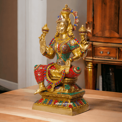 Buy Online Brass Statue of Lakshmi, Sitting Gracefully with Four Arms, Adorned with Intricate Inlay Work Nikuressence