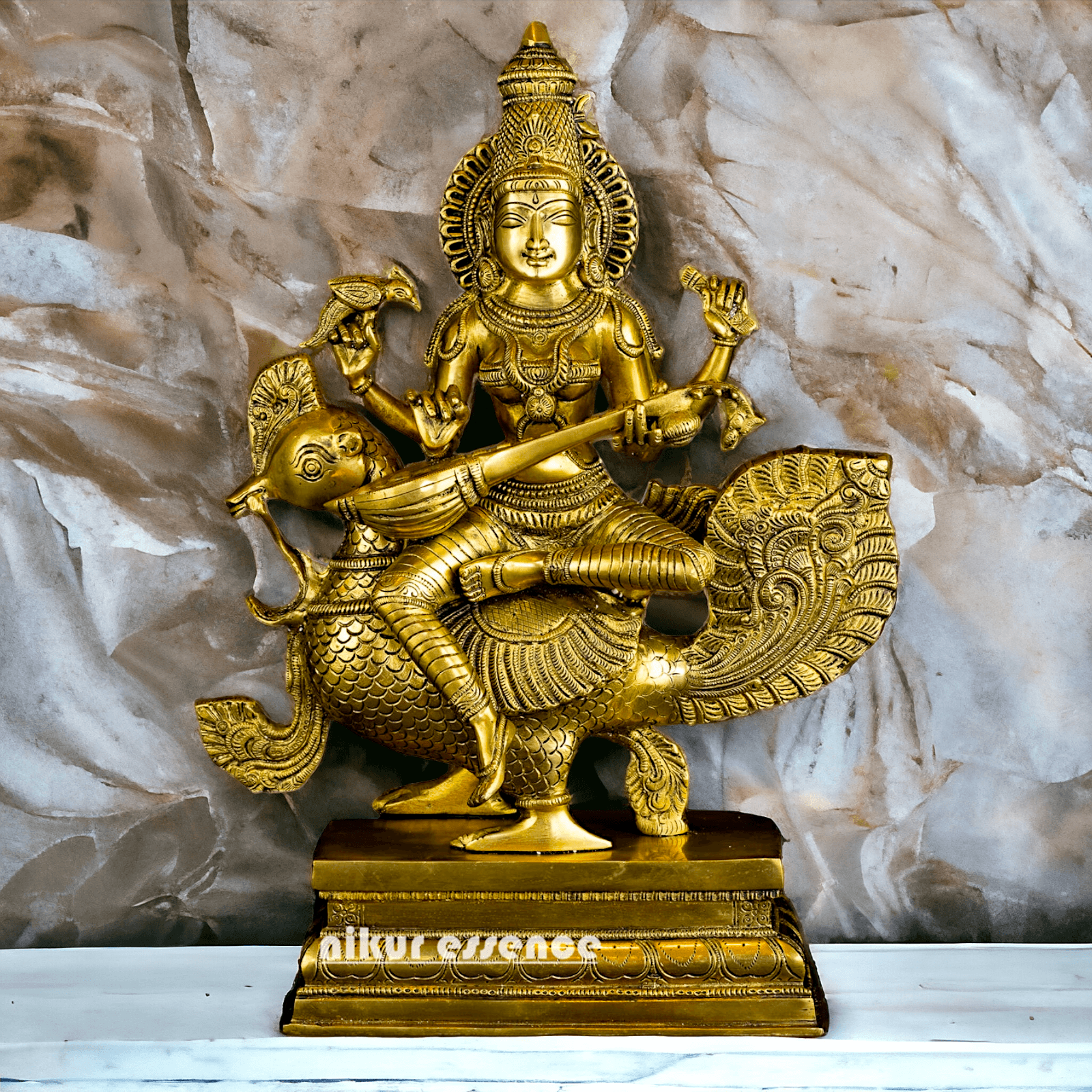 Buy Brass Statue of Devi Sarasvati Seated Gracefully on Her Sacred Peacock Nikuressence