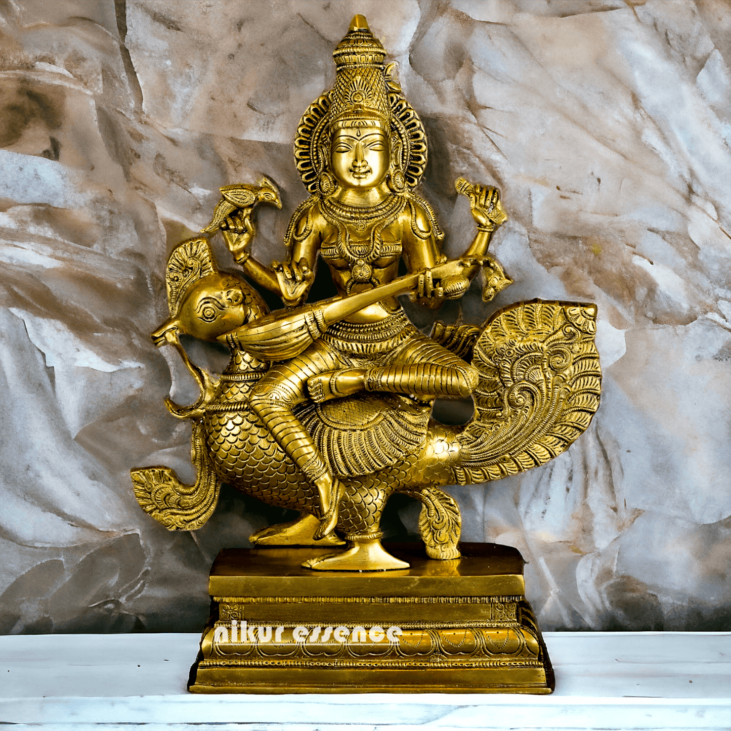 Buy Brass Statue of Devi Sarasvati Seated Gracefully on Her Sacred Peacock Nikuressence