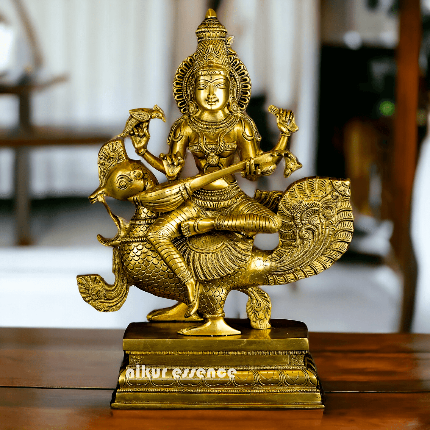 Buy Brass Statue of Devi Sarasvati Seated Gracefully on Her Sacred Peacock Nikuressence