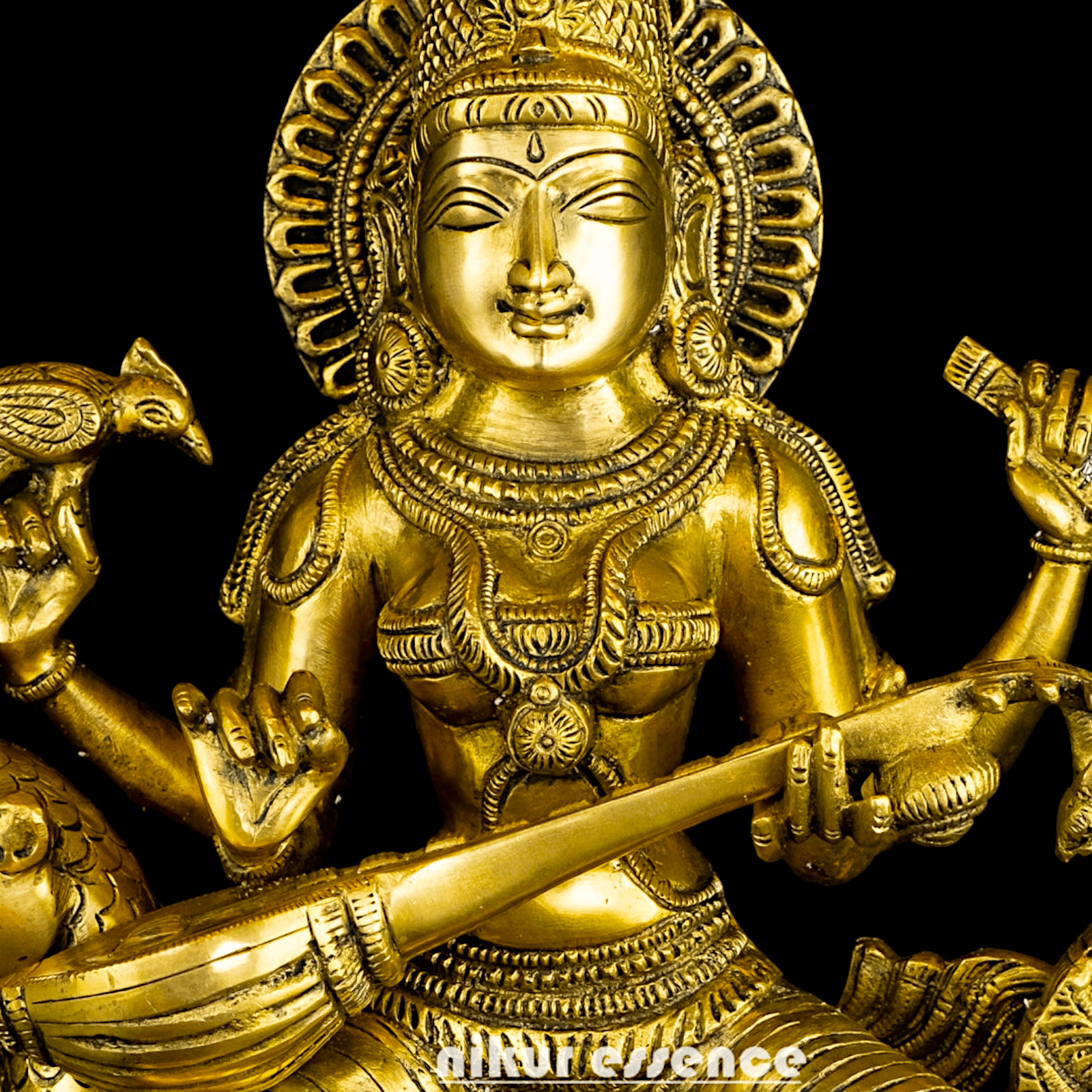 Buy Brass Statue of Devi Sarasvati Seated Gracefully on Her Sacred Peacock Nikuressence