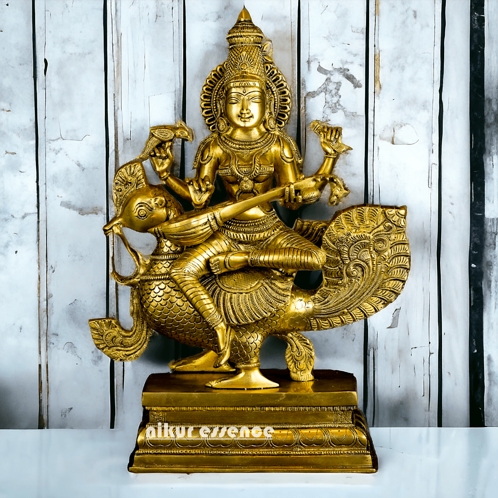 Buy Brass Statue of Devi Sarasvati Seated Gracefully on Her Sacred Peacock Nikuressence