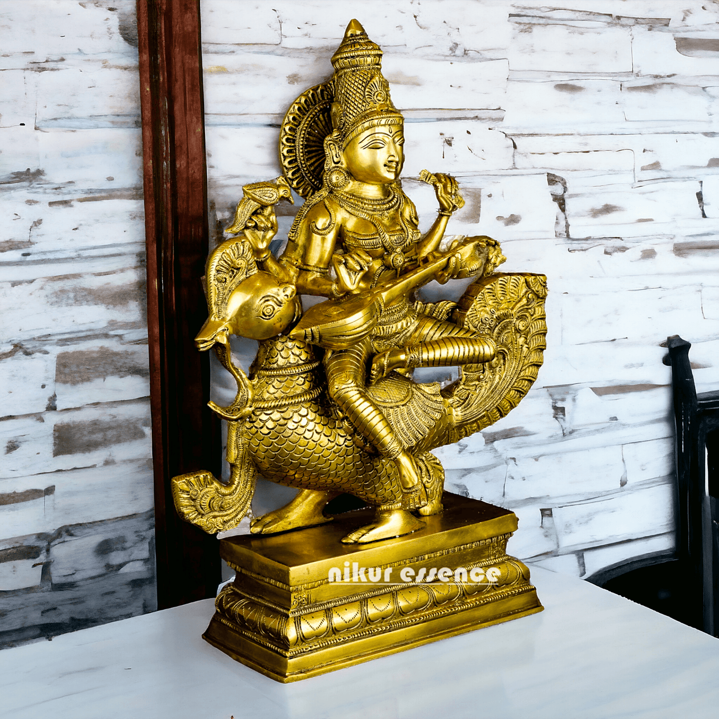 Buy Brass Statue of Devi Sarasvati Seated Gracefully on Her Sacred Peacock Nikuressence