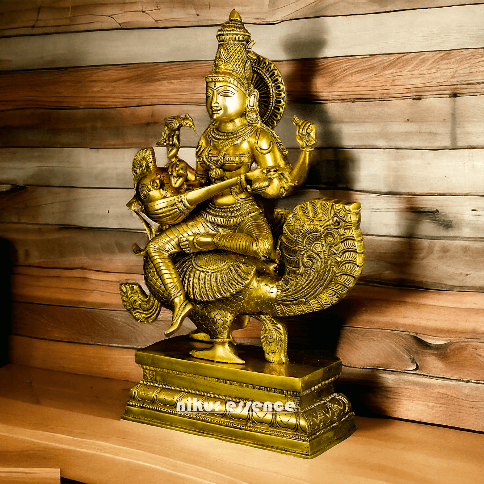 Buy Brass Statue of Devi Sarasvati Seated Gracefully on Her Sacred Peacock Nikuressence