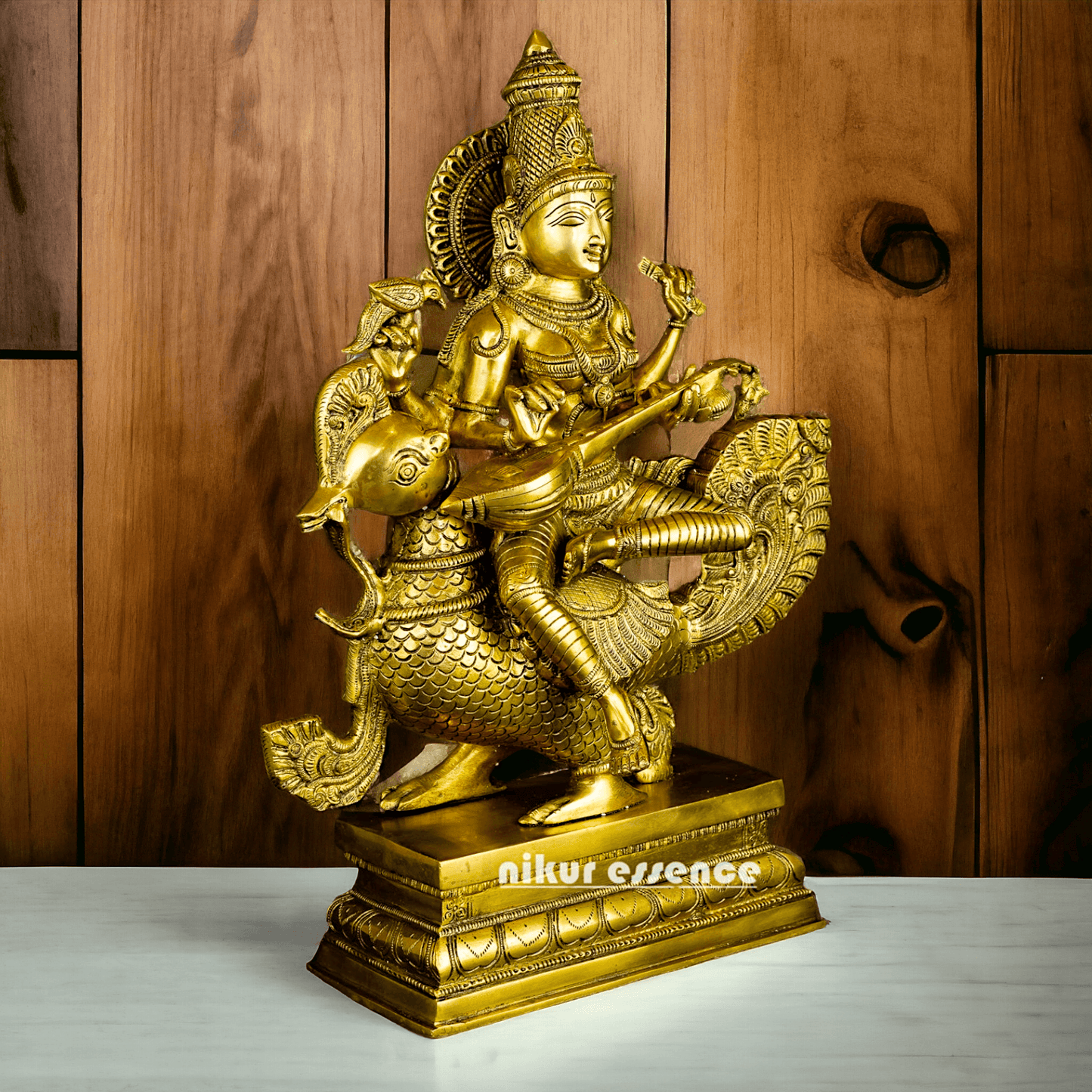 Buy Brass Statue of Devi Sarasvati Seated Gracefully on Her Sacred Peacock Nikuressence