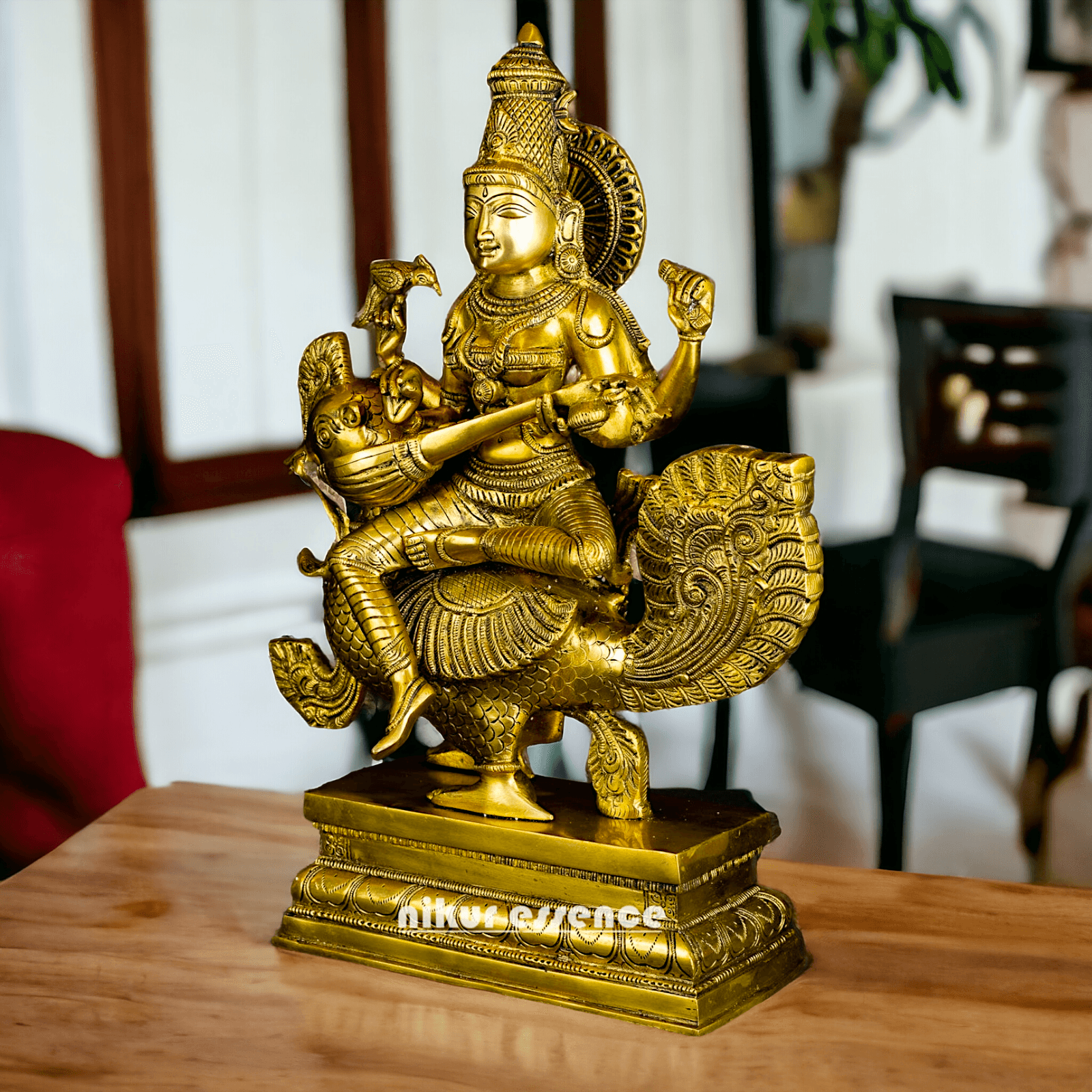 Buy Brass Statue of Devi Sarasvati Seated Gracefully on Her Sacred Peacock Nikuressence