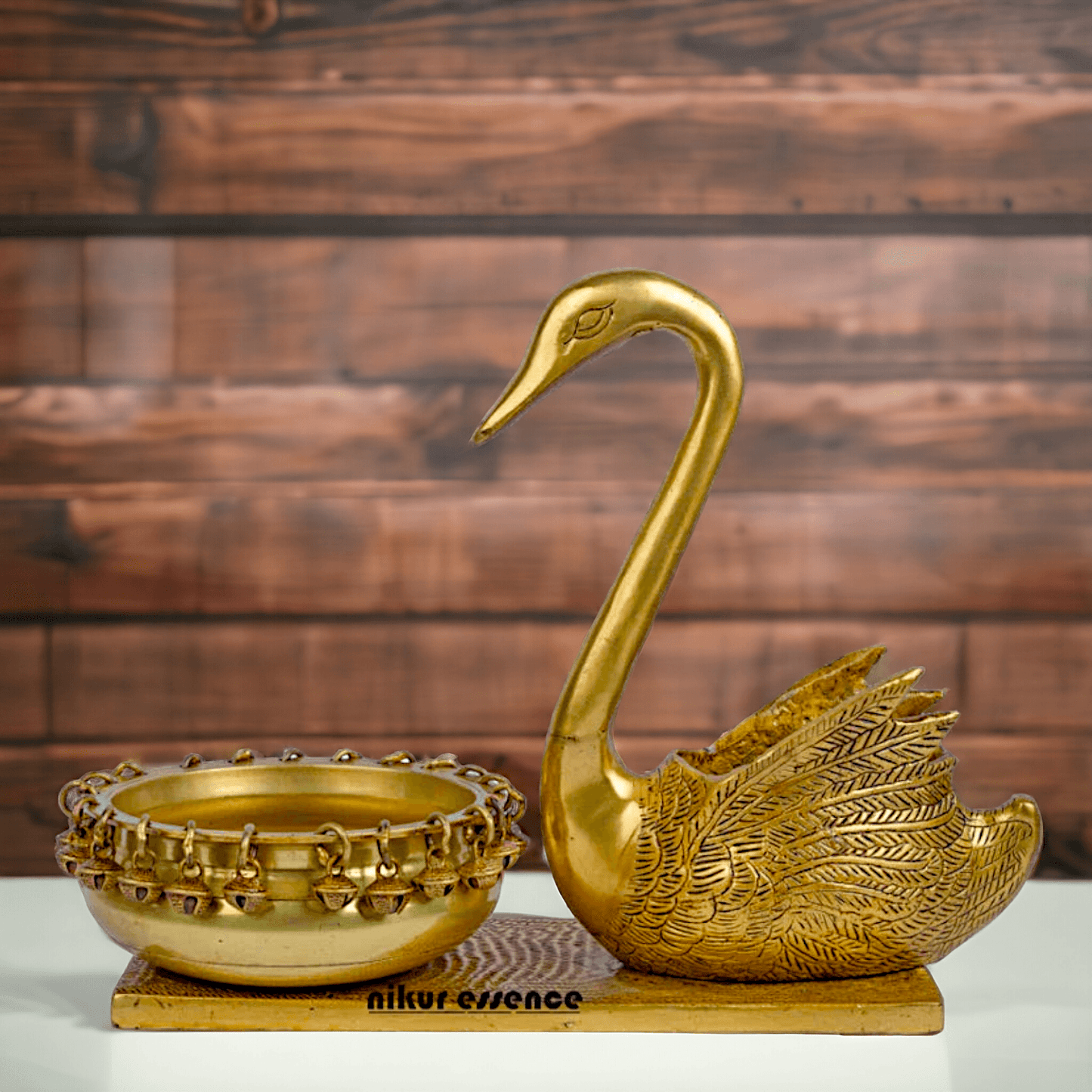 Buy Brass Urli in Swan Decor Bowl Featuring Decorative Bells – 11 Inches Nikuressence