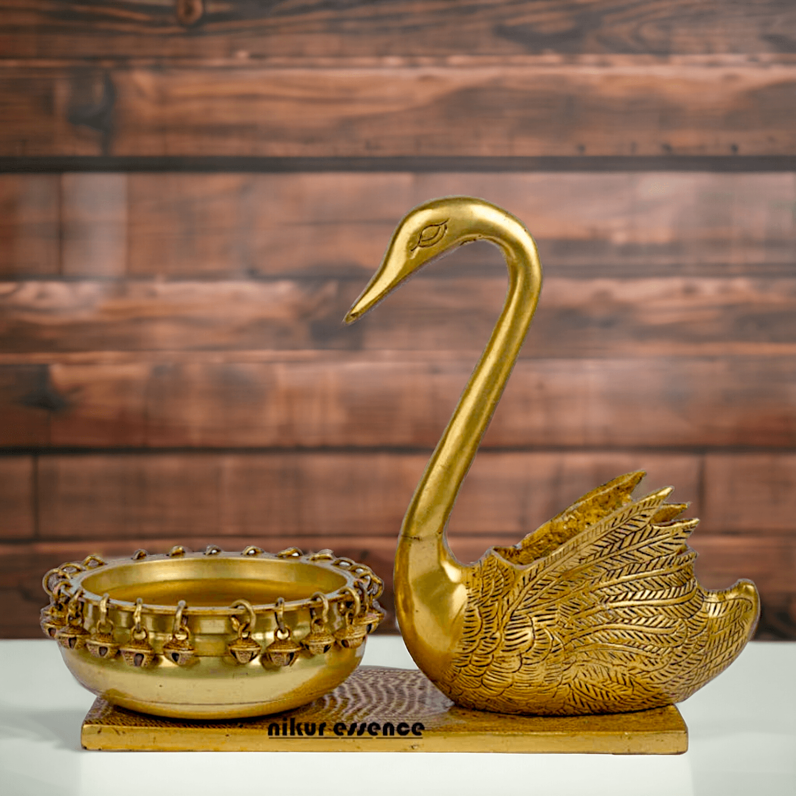Buy Brass Urli in Swan Decor Bowl Featuring Decorative Bells – 11 Inches Nikuressence