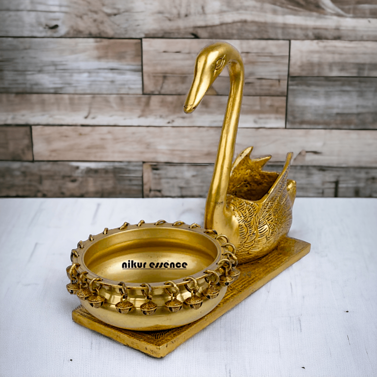 Buy Brass Urli in Swan Decor Bowl Featuring Decorative Bells – 11 Inches Nikuressence
