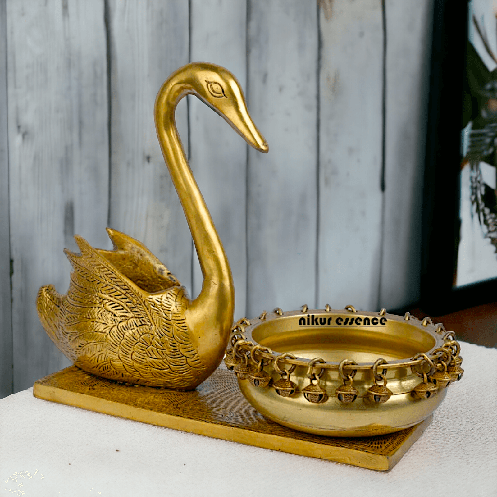 Buy Brass Urli in Swan Decor Bowl Featuring Decorative Bells – 11 Inches Nikuressence