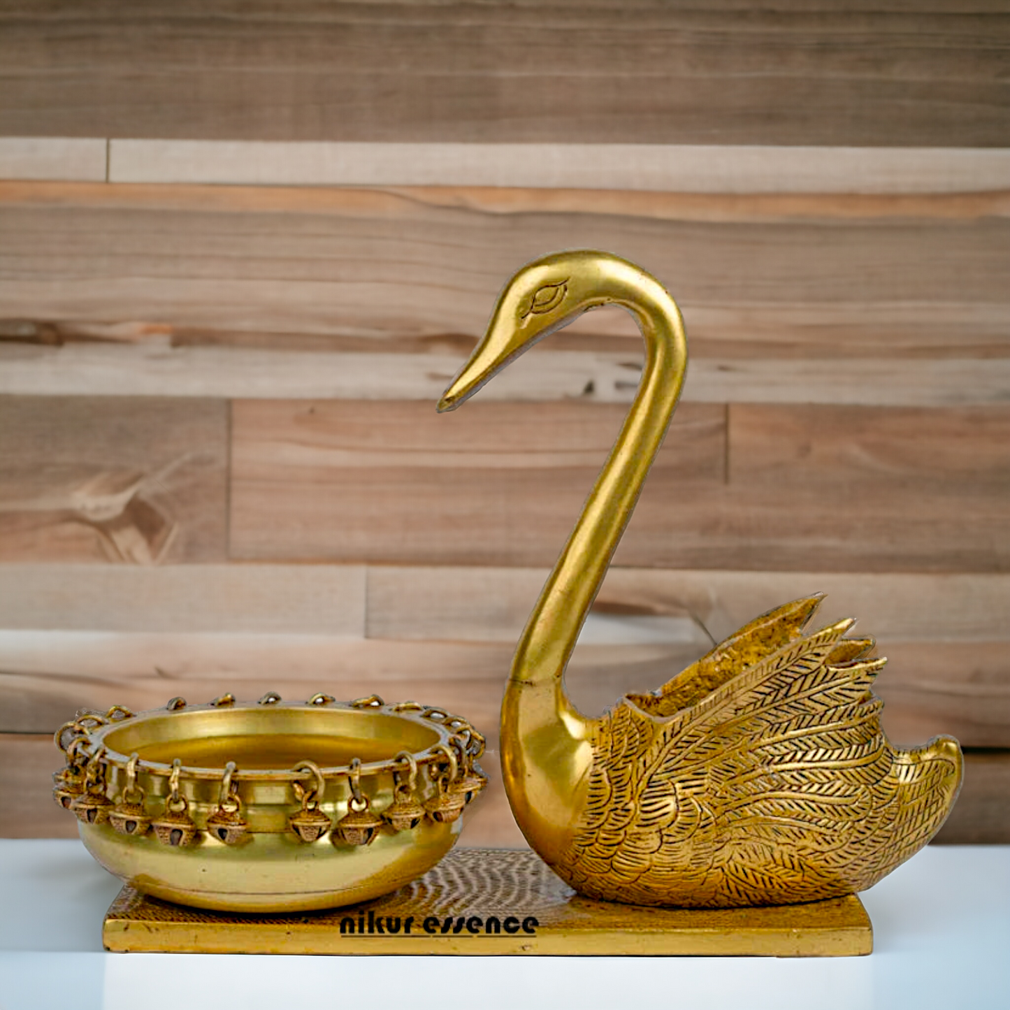 Buy Brass Urli in Swan Decor Bowl Featuring Decorative Bells – 11 Inches Nikuressence