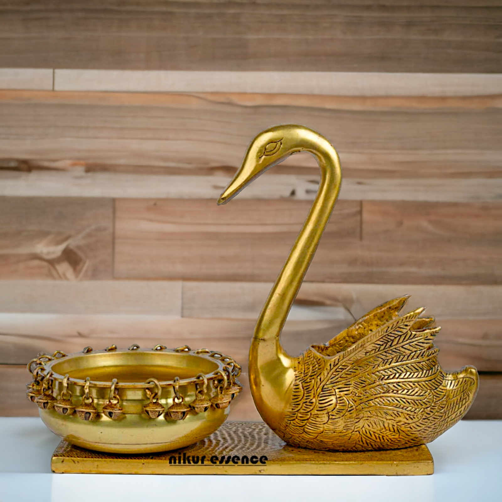 Buy Brass Urli in Swan Decor Bowl Featuring Decorative Bells – 11 Inches Nikuressence