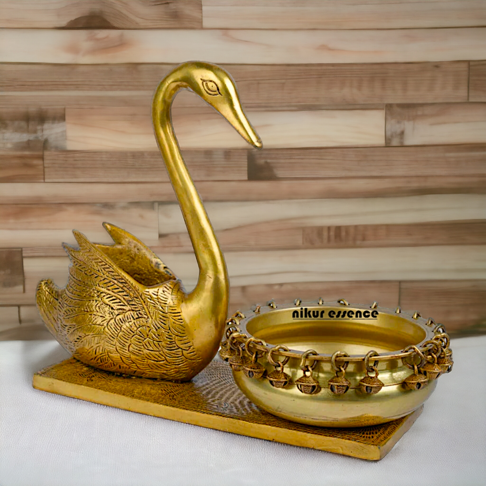 Buy Brass Urli in Swan Decor Bowl Featuring Decorative Bells – 11 Inches Nikuressence