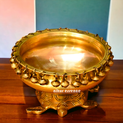 Buy online 8-Inch Traditional Brass Urli with Turtle Design - Handcrafted Decorative Bowl for Home Décor Nikuressence