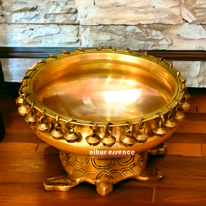 Buy online 8-Inch Traditional Brass Urli with Turtle Design - Handcrafted Decorative Bowl for Home Décor Nikuressence