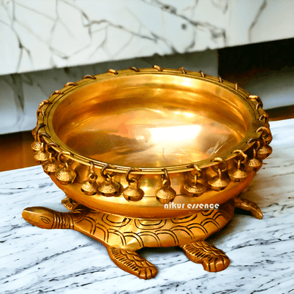 Buy online 8-Inch Traditional Brass Urli with Turtle Design - Handcrafted Decorative Bowl for Home Décor Nikuressence