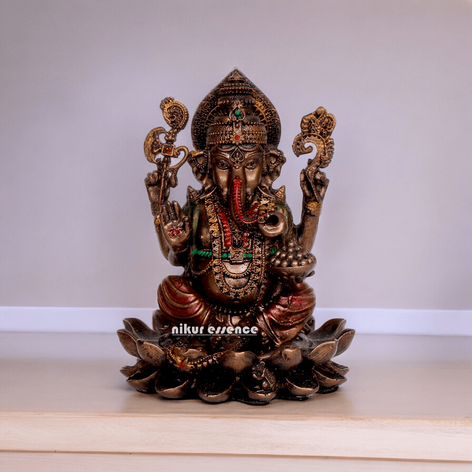 Bonded Bronze Ganesh sitting on lotus Nikur Essence - 4 inch Nikuressence