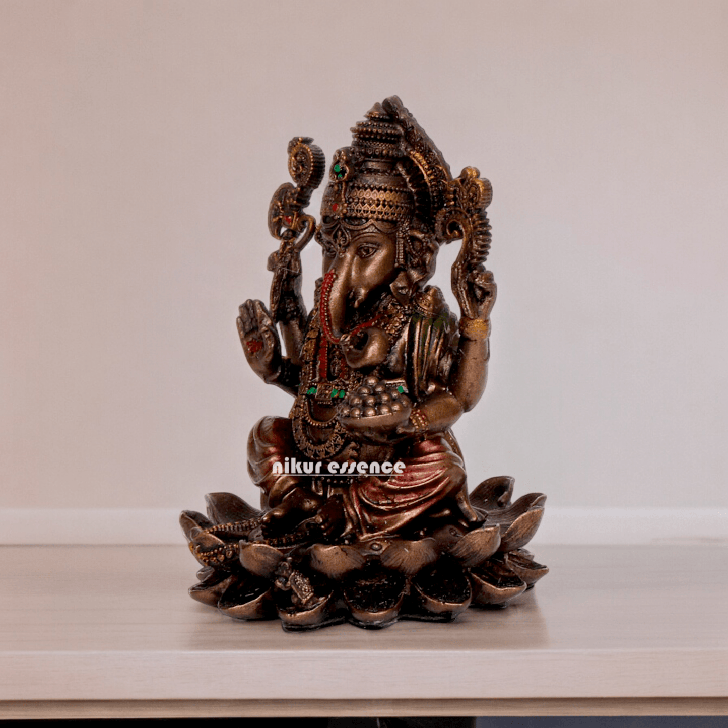 Bonded Bronze Ganesh sitting on lotus Nikur Essence - 4 inch Nikuressence