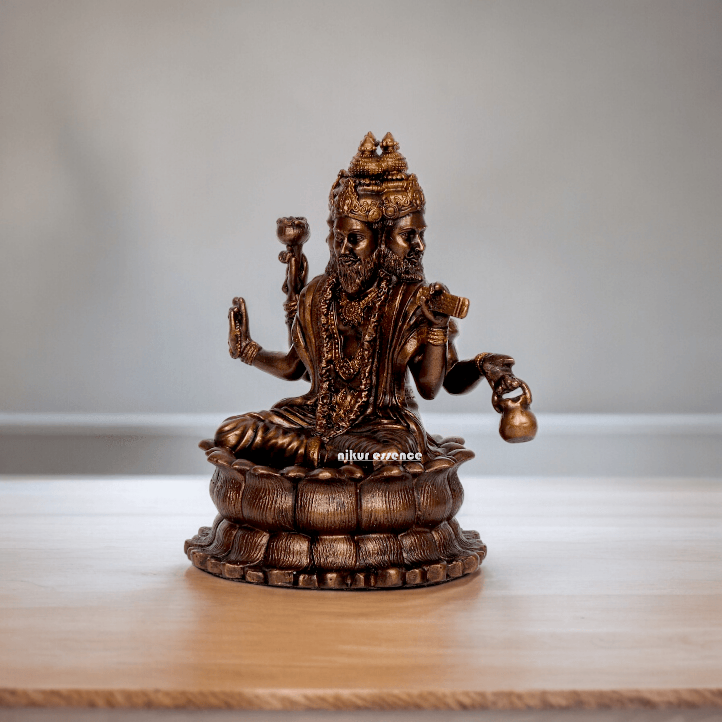 Bonded Bronze Trimurti Idol Depicting Brahma, Vishnu, and Mahesh on Lotus by Nikur Essence - 3.75 Inch Nikuressence