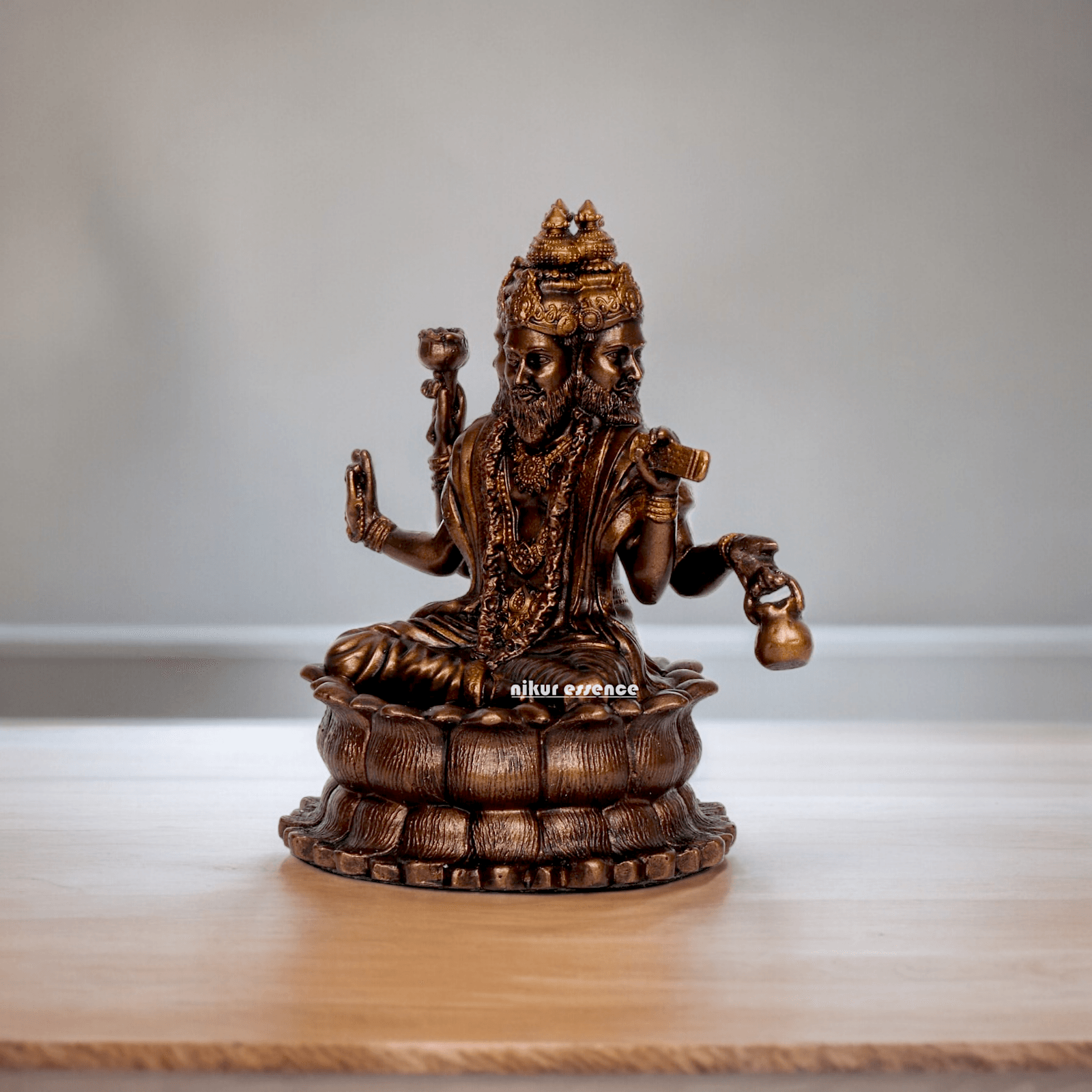 Bonded Bronze Trimurti Idol Depicting Brahma, Vishnu, and Mahesh on Lotus by Nikur Essence - 3.75 Inch Nikuressence