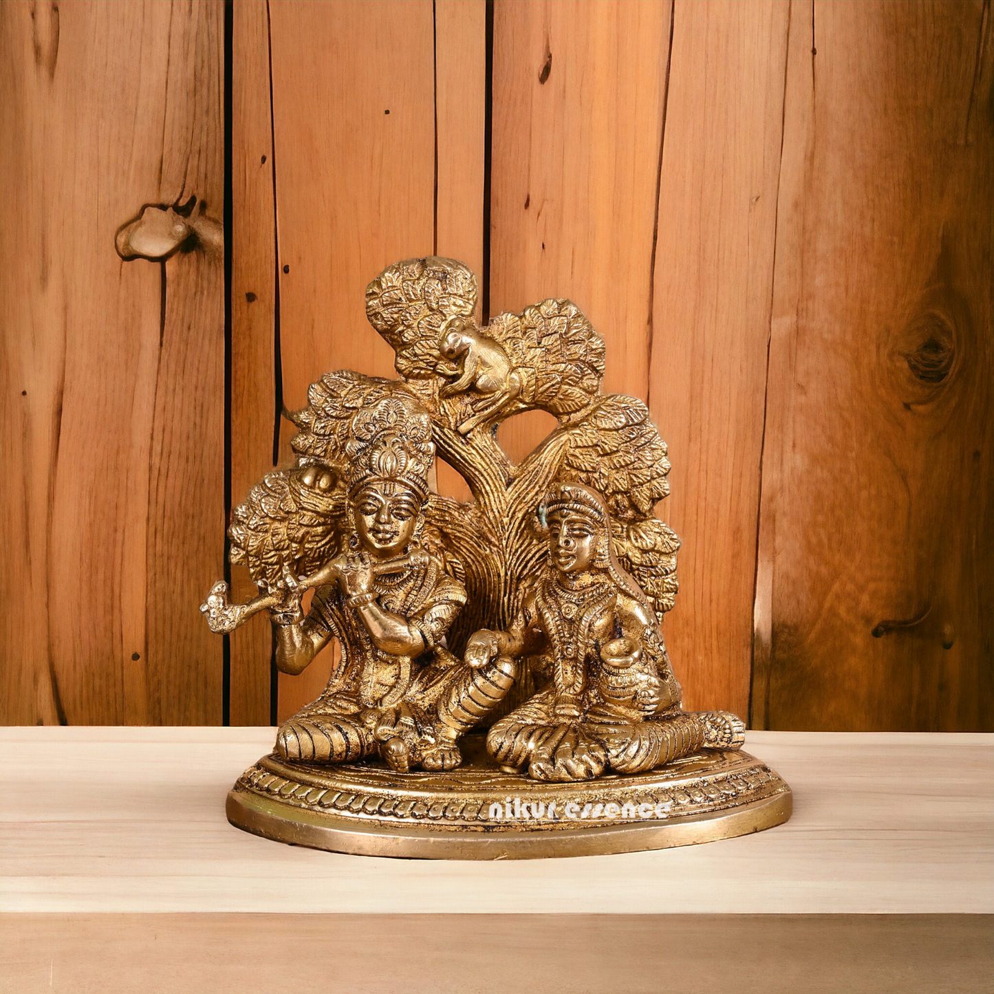 Solid Brass Radha Krishna Sitting with Tree idol - 14 cm Nikuressence
