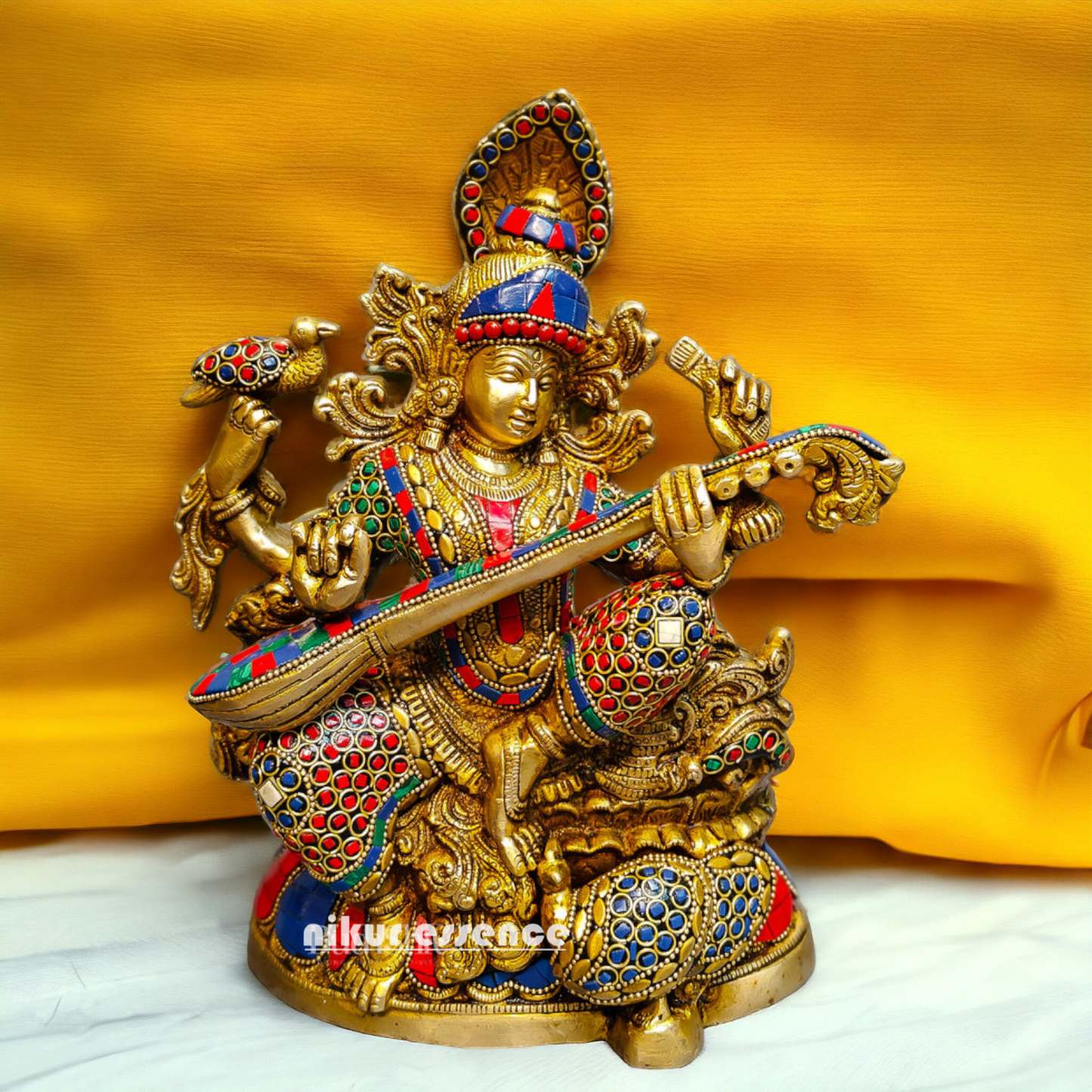 Buy Brass Saraswati Sitting Playing Veena with Stone Work - 27 cm Nikuressence