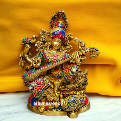 Buy Brass Saraswati Sitting Playing Veena with Stone Work - 27 cm Nikuressence