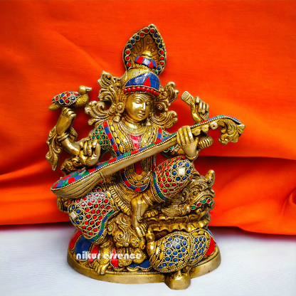 Buy Brass Saraswati Sitting Playing Veena with Stone Work - 27 cm Nikuressence
