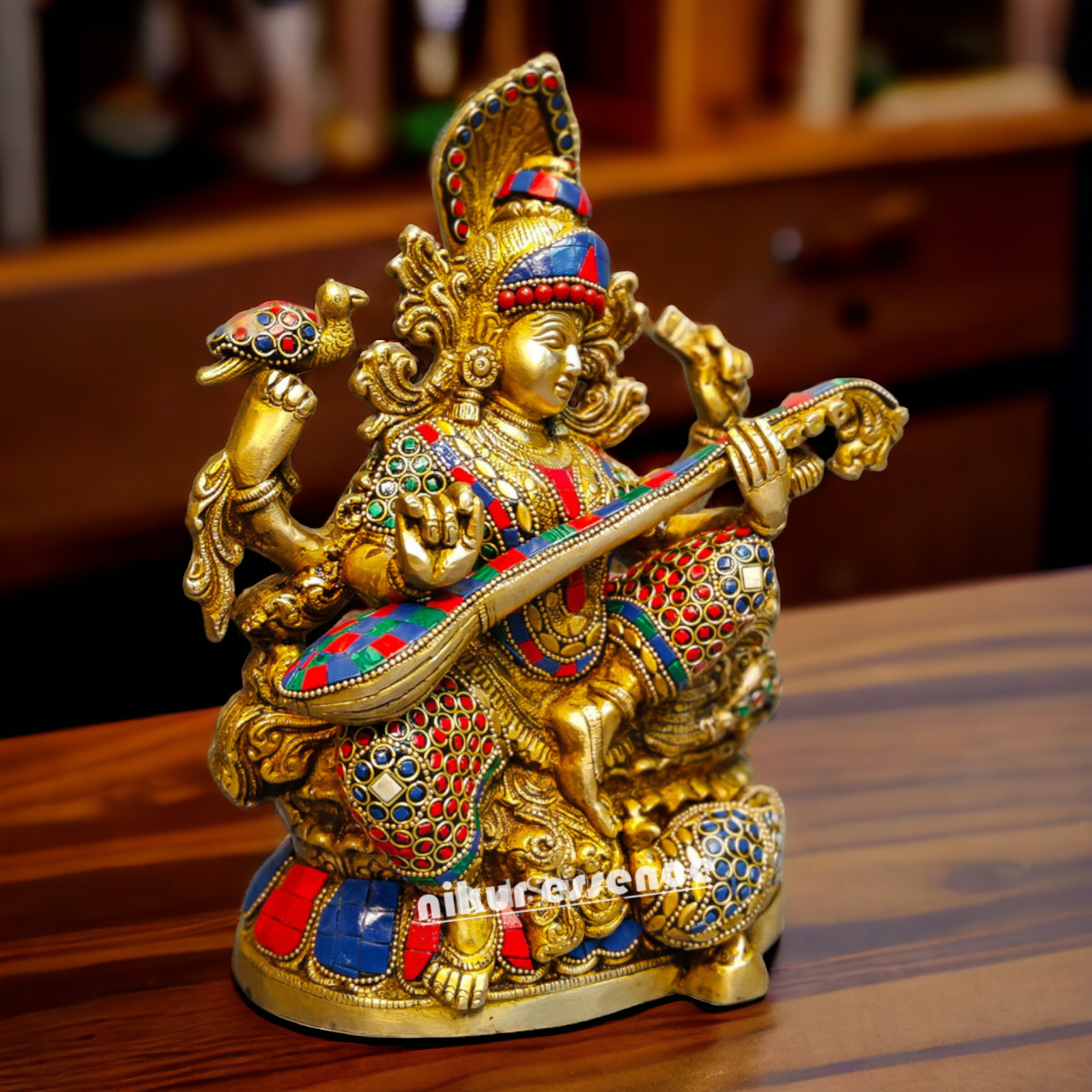 Buy Brass Saraswati Sitting Playing Veena with Stone Work - 27 cm Nikuressence