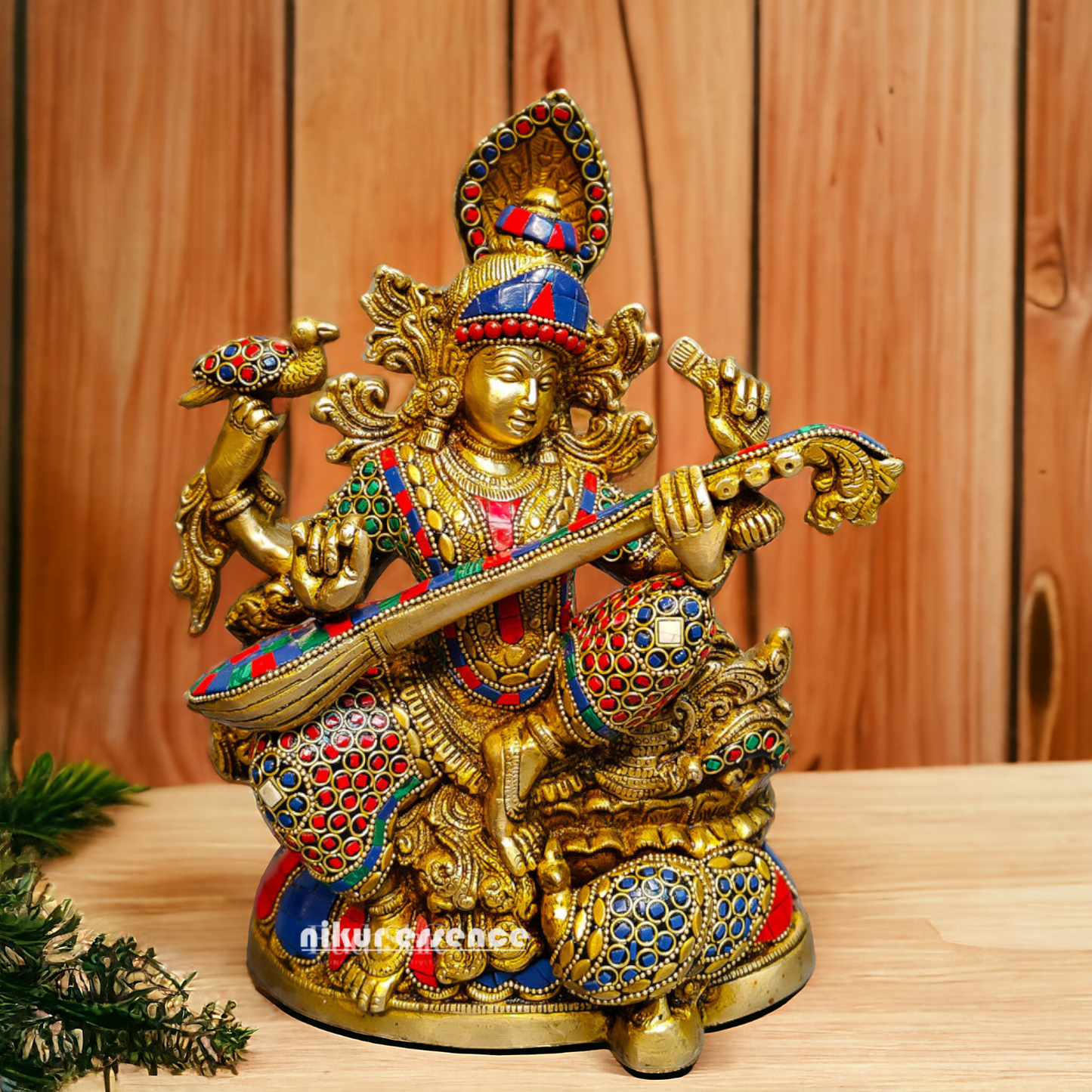 Buy Brass Saraswati Sitting Playing Veena with Stone Work - 27 cm Nikuressence
