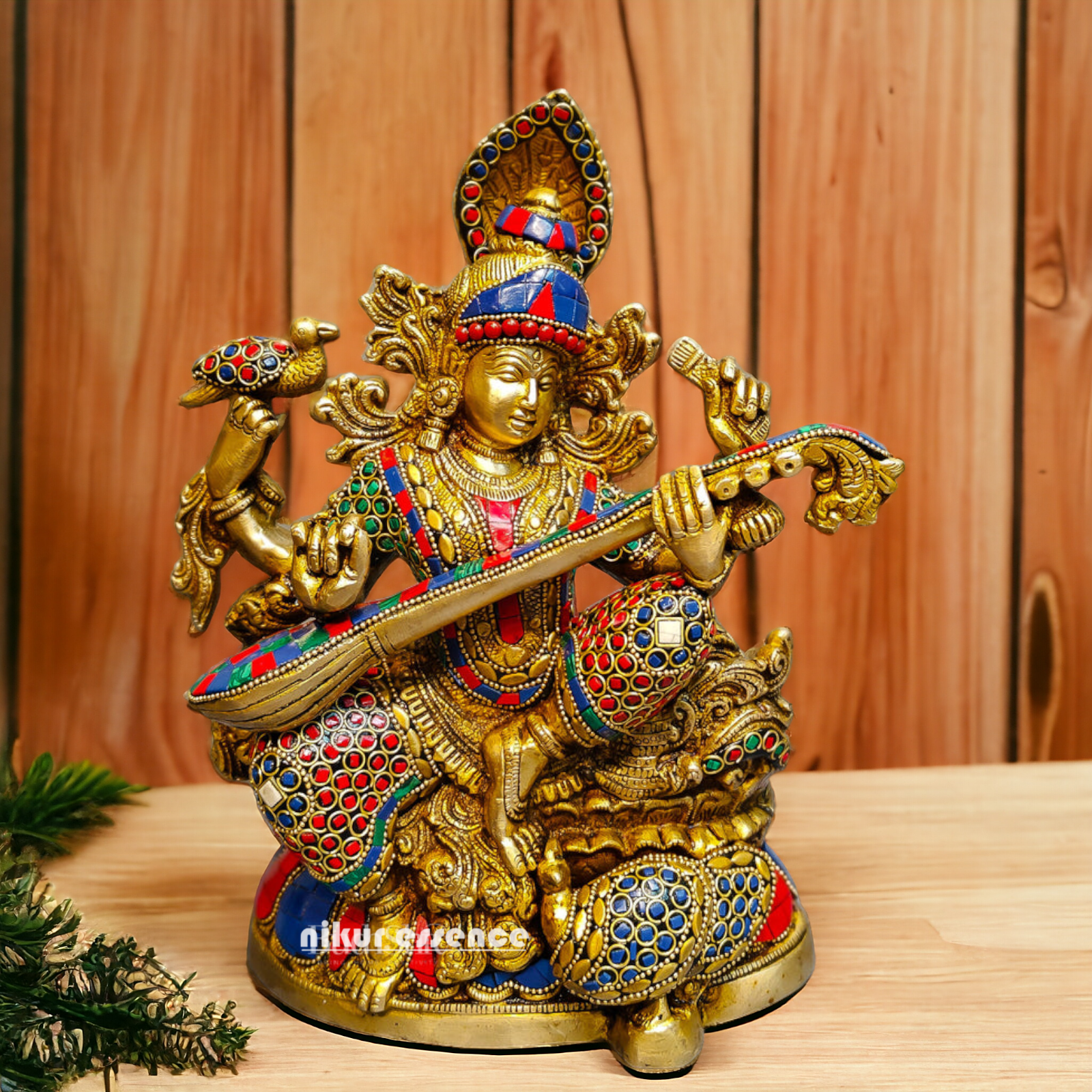 Buy Brass Saraswati Sitting Playing Veena with Stone Work - 27 cm Nikuressence