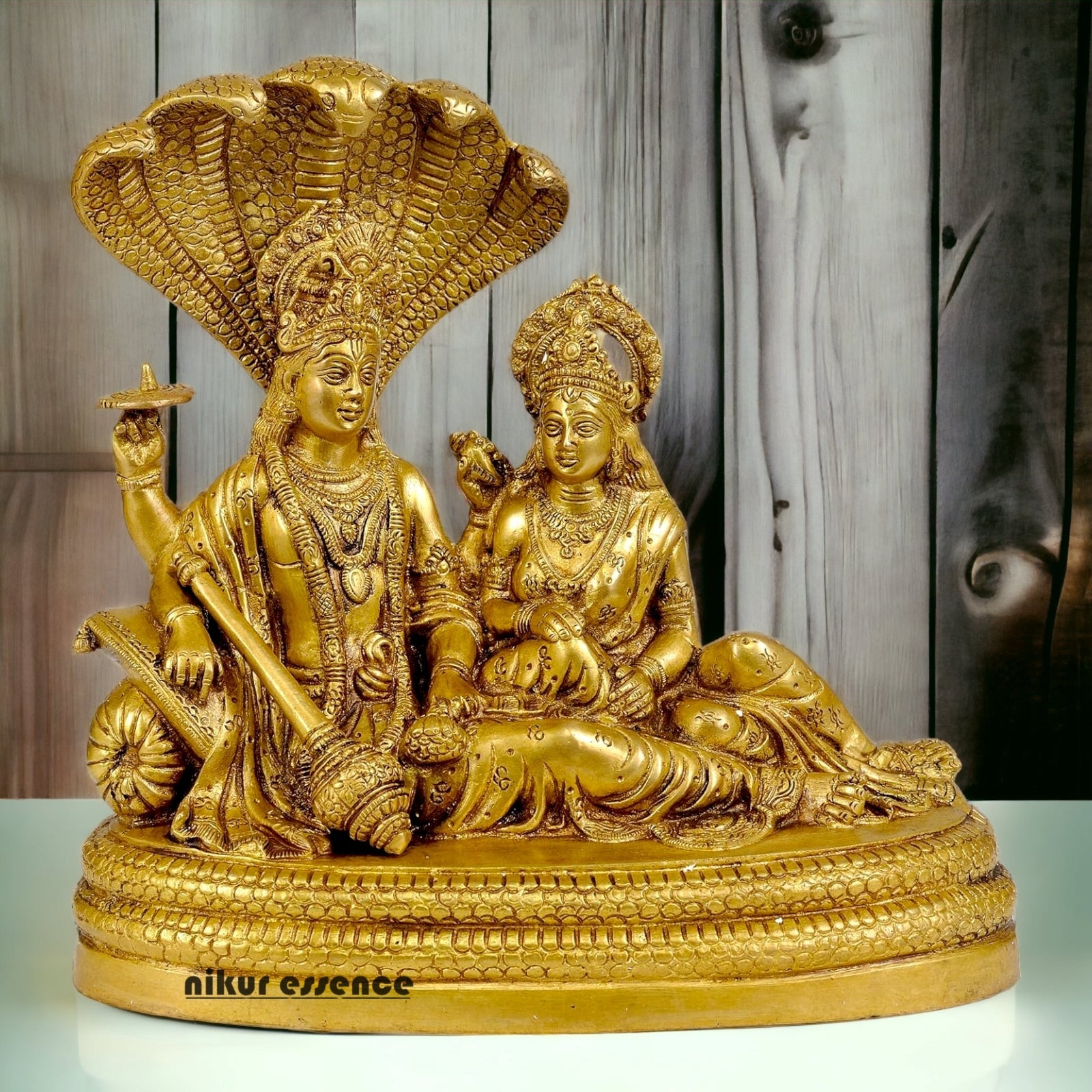 Shop Brass Vishnu Lakshmi Sitting on Sheshnag Idol - 10 inches Nikuressence