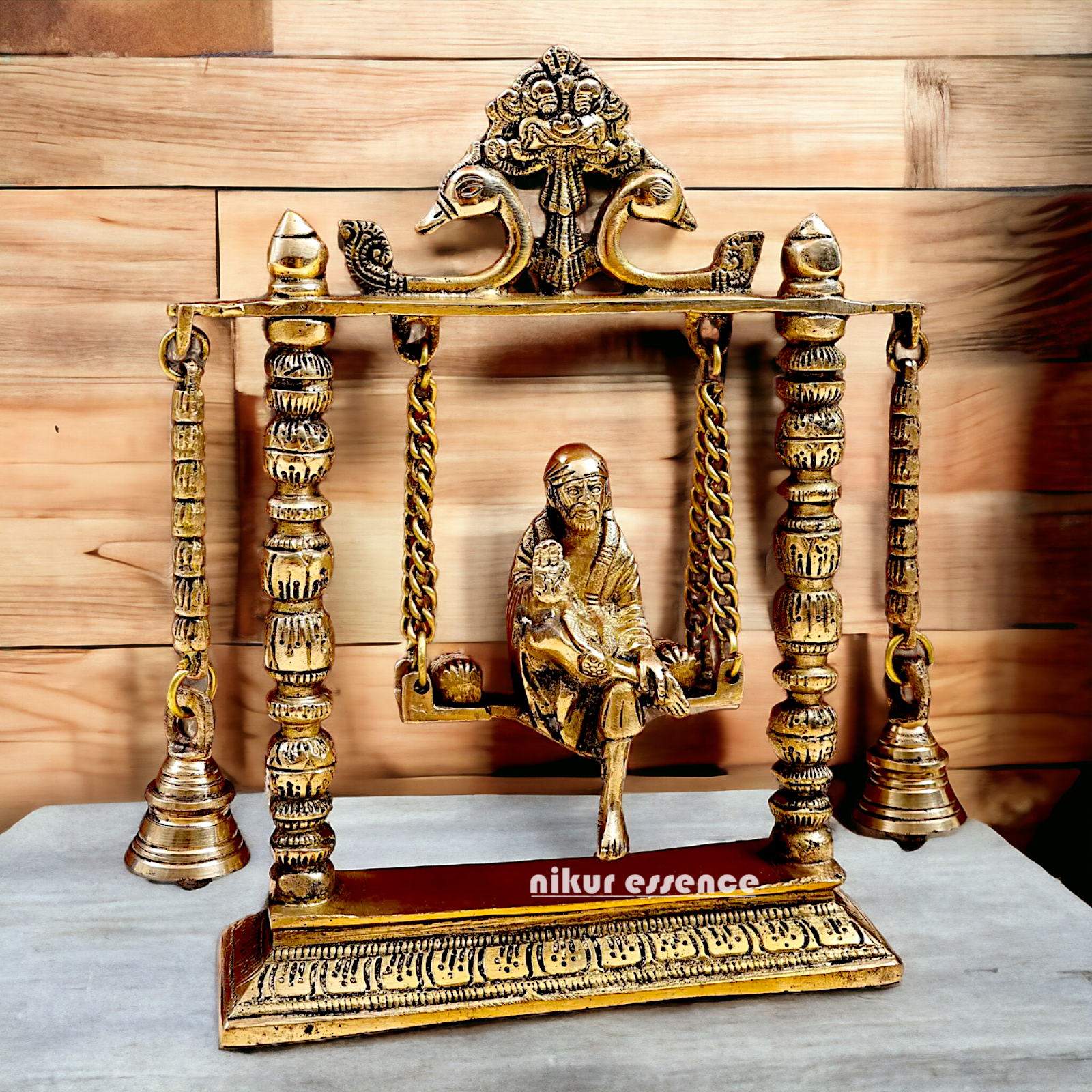 buy Sai Baba swinging Jhula Solid brass idol - 10 inches Nikuressence