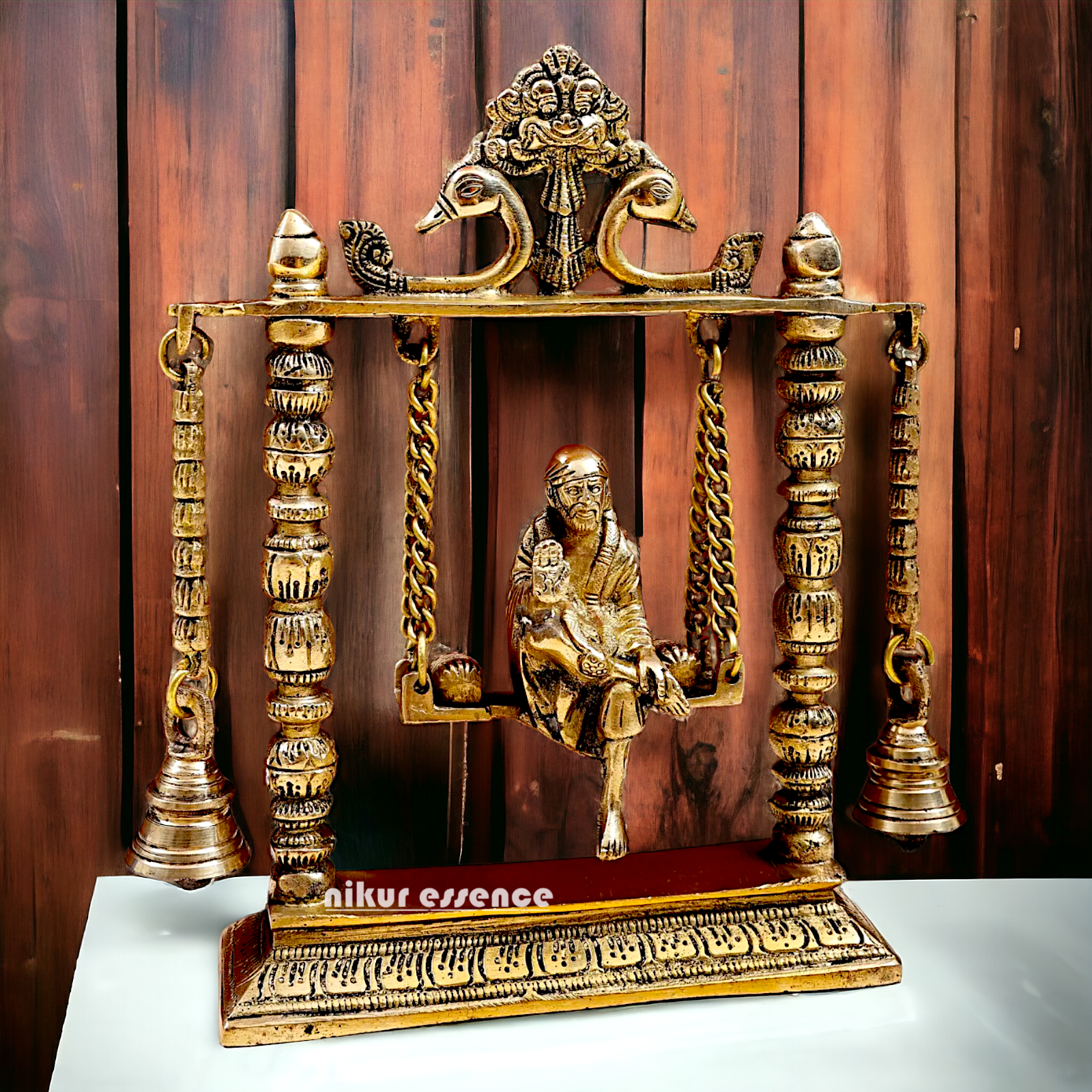 buy Sai Baba swinging Jhula Solid brass idol - 10 inches Nikuressence