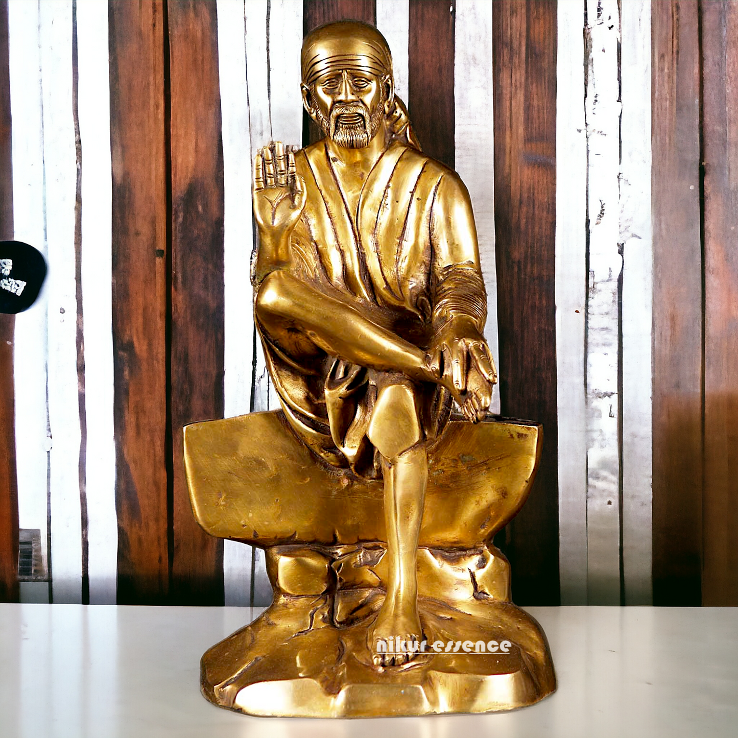 Pure Brass Sai Baba Sitting on Stone idol - 12 inches Nikuressence